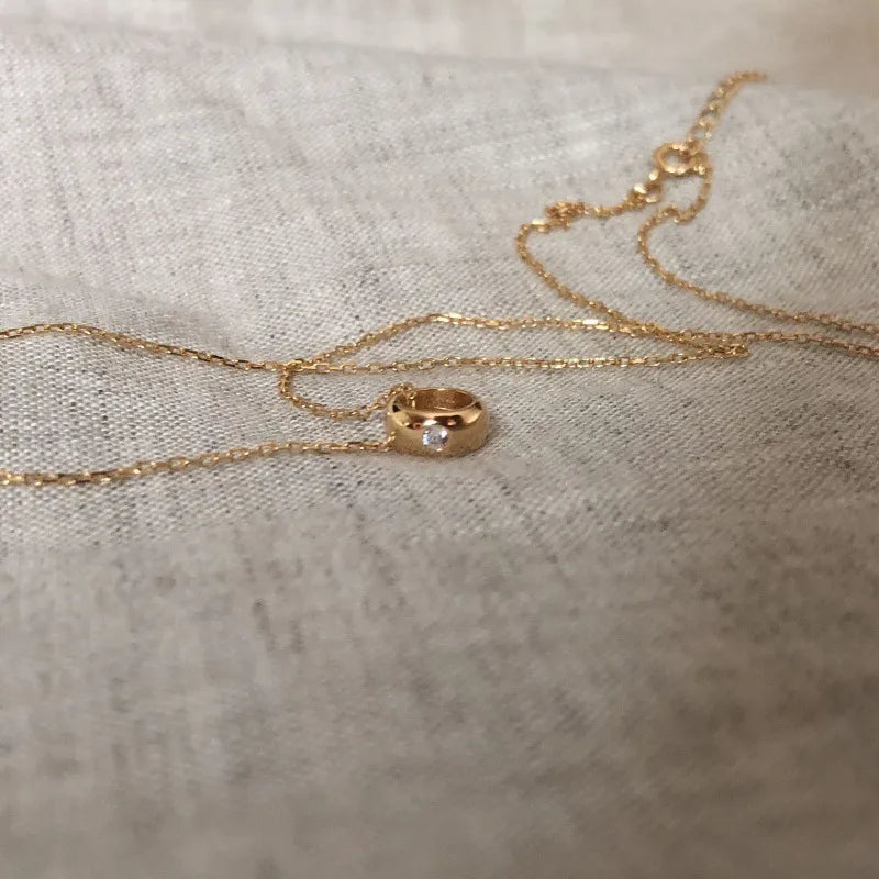 18K gold plated pendant necklace with a small gemstone on a delicate chain
