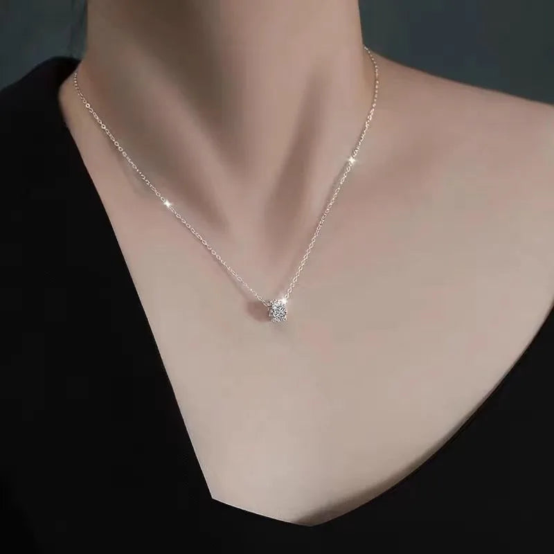 Delicate gold-plated necklace with small cubic pendant, elegant minimalist jewelry