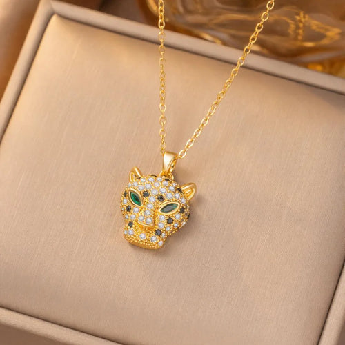 18K gold plated leopard pendant necklace with green eyes and crystal accents on a gold chain