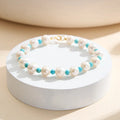 18K gold plated bracelet with white pearls and turquoise beads on white display